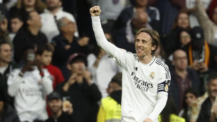 (FILES) Real Madrids Croatian midfielder #10 Luka Modric celebrates scoring the opening goal during the Spanish league football match between Real Madrid CF and Girona FC at Santiago Bernabeu Stadium in Madrid on February 23, 2025. Real Madrids Croatian midfielder Luka Modric said on May 22, 2025 he would leave the Spanish giants after the Club World Cup this summer. (Photo by Pierre-Philippe MARCOU / AFP)