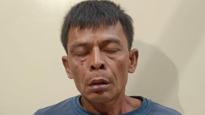 Tampang pelaku Ujang saat ditangkap polisi.