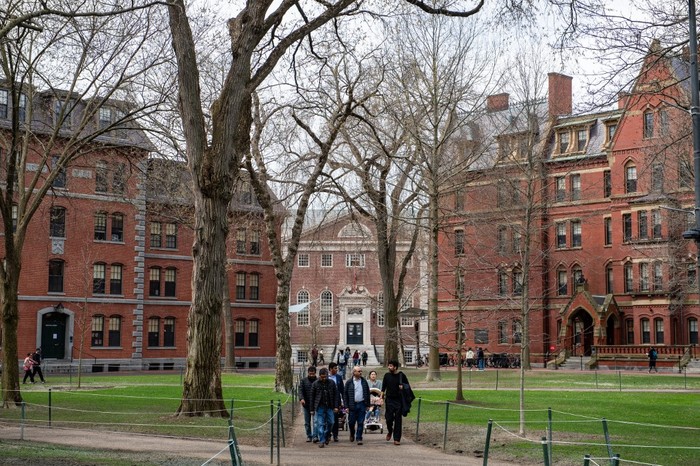 (FILES) People walk through Harvard Yard on the Harvard University campus in Cambridge, Massachusetts, on April 15, 2025. US President Donald Trumps administration on Thursday revoked Harvards right to enroll foreign students -- more than a quarter of its annual enrollment -- in a major escalation of the presidents fight with one of the worlds most storied universities. Trump is furious at Harvard -- which has produced 162 Nobel prize winners -- for rejecting his demand that it submit to oversight on admissions and hiring over his claims that it is a hotbed of anti-Semitism and woke liberal ideology. (Photo by Joseph Prezioso / AFP)
