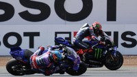 Petaka menimpa Quartararo jelang akhir lap ke-12. Motornya mengalami masalah dan kehilangan tenaga, membuatnya disalip rider-rider lain. (Foto: AFP/ADRIAN DENNIS)