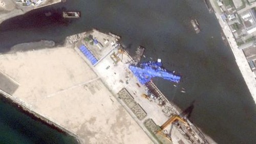 This satellite image taken and released on May 23, 2025 by Planet Labs PBC shows a new North Korean warship that appears to be capsised at the harbour after its launching ceremony in Chongjin. A major accident occurred at the launch ceremony for a new North Korean naval destroyer, state media reported on May 22, with leader Kim Jong Un calling the mishap a 
