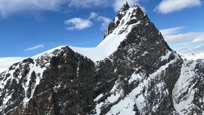 This handout photograph taken on May 24, 2025 and released on May 25, 2025 by the police of the Swiss Canton of Valais shows the Rimpfischhorn mountain peak where five skiers found dead on the Adler glacier in Zermatt region. (AFP)