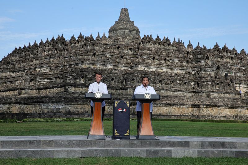 Indonesia's President Prabowo Subianto and French President Emmanuel Macron speak during a visit at Borobudur Temple, in Magelang, Java, Indonesia, May 29, 2025. YASUYOSHI CHIBA/Pool via REUTERS