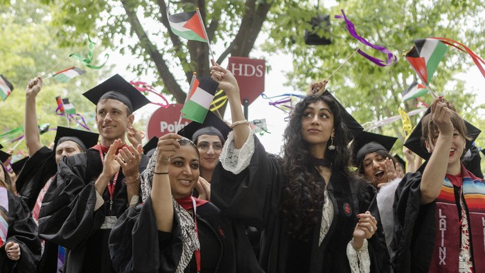 CAMBRIDGE, MASSACHUSETTS - MAY 29: Graduates from Harvard Divinity School celebrate during their commencement ceremony on May 29, 2025 in Cambridge, Massachusetts. The joyous occasion unfolds amid escalating tensions between Harvard and the Trump adm