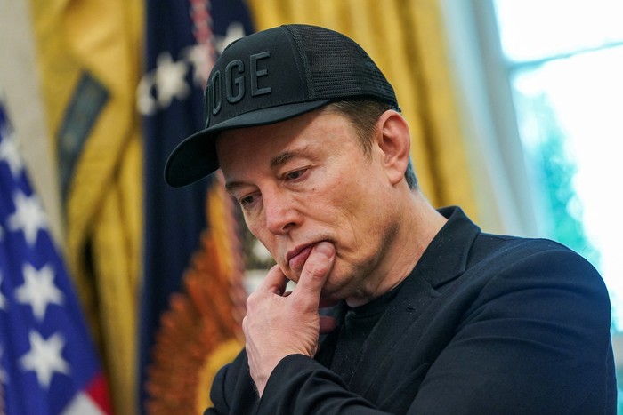 Elon Musk receives the key to the White House from U.S. President Donald Trump during a press conference in the Oval Office at the White House, in Washington, D.C., U.S., May 30, 2025. REUTERS/Nathan Howard