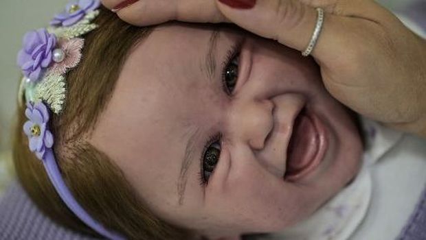 View of the head of a reborn baby doll at the store Alana Babys Maternity in Campinas, Sao Paulo state, Brazil on May 16, 2025. The super realistic dolls, called Reborn Babies, feature details such as nails, eyelashes, veins, folds and spots on the body, which make them look like real babies. (Photo by Nelson ALMEIDA / AFP)