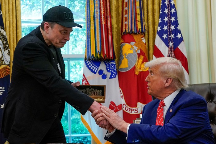 U.S. President Donald Trump and Elon Musk attend a press conference in the Oval Office of the White House in Washington, D.C., U.S., May 30, 2025. REUTERS/Nathan Howard