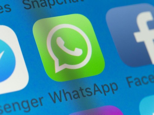 London, UK - August 01, 2018: The buttons of WhatsApp, Facebook, Messenger, Snapchat and Messages on the screen of an iPhone.