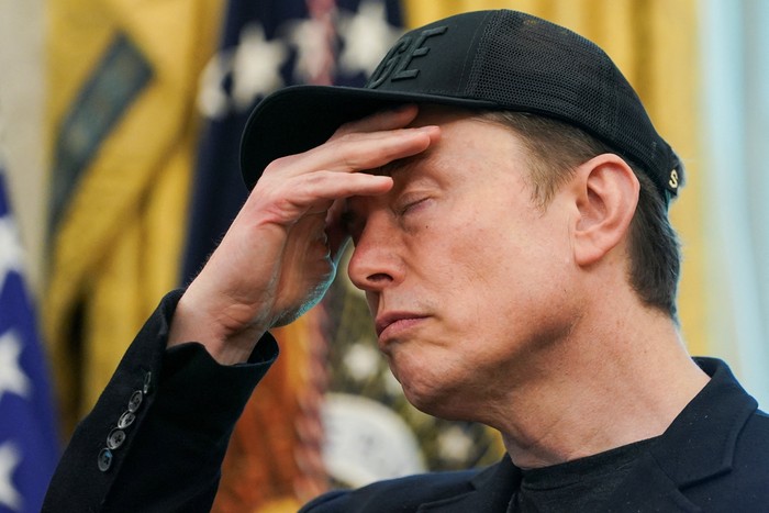 Elon Musk reacts during a press conference with U.S. President Donald Trump (not pictured), at the White House in Washington, D.C., U.S., May 30, 2025. REUTERS/Nathan Howard