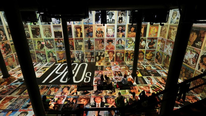 Guests take a picture during Rolling Stone presents: AMPLIFIED exhibition at ARTECHOUSE in New York City, U.S. May 29, 2025. REUTERS/Jeenah Moon.