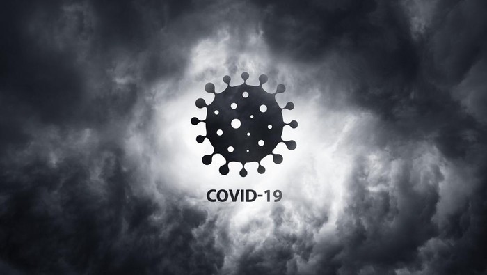 Warning about the scary COVID-19 virus. World pandemic with coronavirus COVID19. Wuhan city is a threat to humanity. Bacteria on a background of thunderclouds