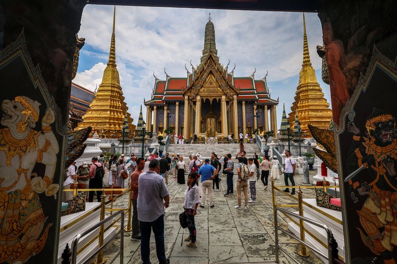 Tourists are seen inside the Grand Palace, one of the favourite tourist spots in Bangkok, Thailand, May 20, 2025. REUTERS/Athit Perawongmetha
