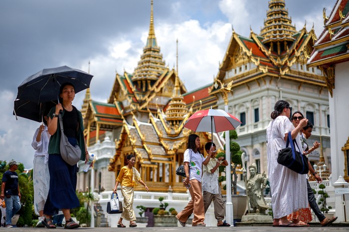 Tourists are seen inside the Grand Palace, one of the favourite tourist spots in Bangkok, Thailand, May 20, 2025. REUTERS/Athit Perawongmetha