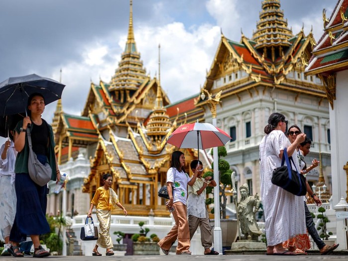 Tourists are seen inside the Grand Palace, one of the favourite tourist spots in Bangkok, Thailand, May 20, 2025. REUTERS/Athit Perawongmetha