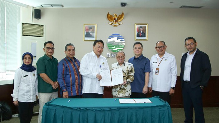 Penandatanganan perjanjian kerja sama pelaksanaan OMC untuk Sumsel dan Jambi.
