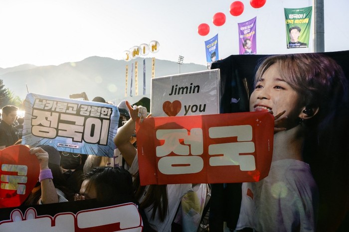 Fans of K-pop boy band BTS wait for members Jimin and Jungkook at an outdoor sporting facility in Yeoncheon on June 11, 2025, shortly before their release from 18 months of South Korean military service. Two other members of K-pop supergroup BTS were released from South Korea's mandatory military service on June 10 and announced they wanted to start performing again 