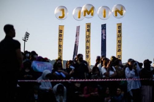 Fans of K-pop boy band BTS wait for members Jimin and Jungkook at an outdoor sporting facility in Yeoncheon on June 11, 2025, shortly before their release from 18 months of South Korean military service. Two other members of K-pop supergroup BTS were released from South Korea's mandatory military service on June 10 and announced they wanted to start performing again 