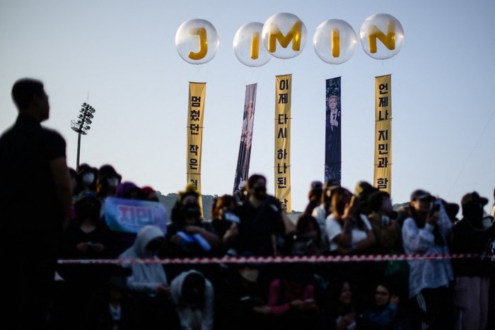Fans of K-pop boy band BTS wait for members Jimin and Jungkook at an outdoor sporting facility in Yeoncheon on June 11, 2025, shortly before their release from 18 months of South Korean military service. Two other members of K-pop supergroup BTS were released from South Korea's mandatory military service on June 10 and announced they wanted to start performing again 