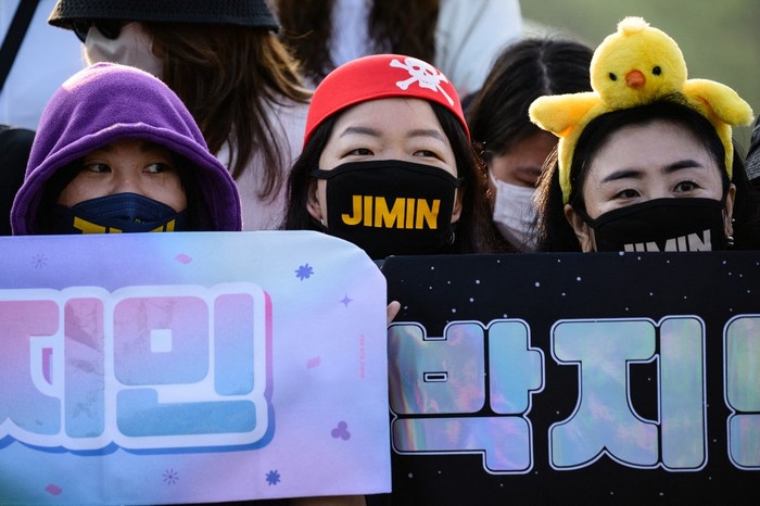 Fans of K-pop boy band BTS wait for members Jimin and Jungkook at an outdoor sporting facility in Yeoncheon on June 11, 2025, shortly before their release from 18 months of South Korean military service. Two other members of K-pop supergroup BTS were released from South Korea's mandatory military service on June 10 and announced they wanted to start performing again 
