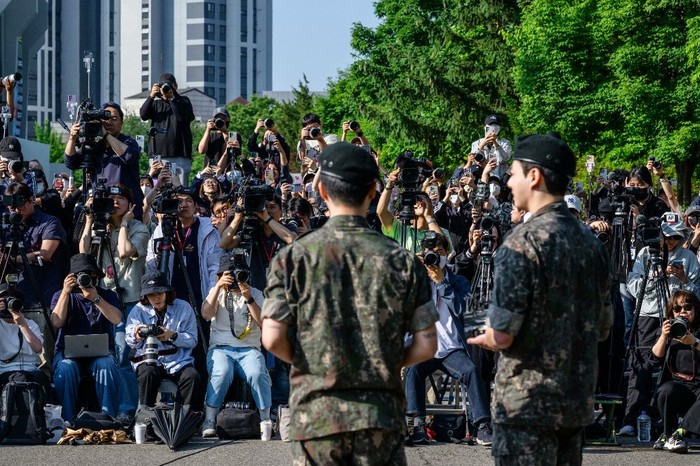Fans of K-pop boy band BTS wait for members Jimin and Jungkook at an outdoor sporting facility in Yeoncheon on June 11, 2025, shortly before their release from 18 months of South Korean military service. Two other members of K-pop supergroup BTS were released from South Korea's mandatory military service on June 10 and announced they wanted to start performing again 