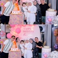 Keluarga besar Ayu turut hadir dan berpose bersama di depan dekorasi backdrop bernuansa pink. Juga terlihat 2 buah kue ulang tahun yang sudah disiapkan untuk Syifa. Foto: Instagram/@ayutingting92
