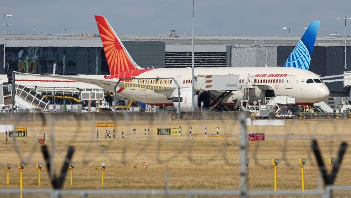 Air India Boeing 787 Dreamliner aircraft as seen at the gates of the terminal of London Heathrow airport during a cloudy day from  Myrtle Avenue, a famous planespotting location. The modern and advanced Boeing Dreamliners are 787-8 wide body passenger plane powered by 2x GE jet engines. Air India connects daily India to London with flights from the Indian cities of Ahmedabad, Amritsar, Delhi, Goa, Hyderabad, Kochi and Mumbai. Air India is the Indian flag carrier with headquarters at New Delhi and member of Star Alliance aviation group. Air India is owned by Tata Group, formerly AirIndia Limited was owned by the Government of India. London Heathrow Airport LHR, United Kingdom on August 2022 (Photo by Nicolas Economou/NurPhoto via Getty Images)