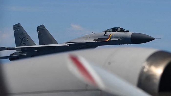 This handout photo taken on June 8, 2025 and received on June 12, 2025 from Japans Ministry of Defence shows a J-15 fighter jet from the Chinese aircraft carrier Shandong making an unusual approach to a Japan Maritime Self-Defence Force P-3C patrol aircraft that was conducting surveillance above the Pacific Ocean. Tokyo said on June 12, it had expressed serious concerns to Beijing after Chinese fighter jets flew 
