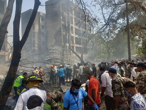 Emergency personnel and other people gather near damaged property, at the site where an Air India plane crashed, in Ahmedabad, India, June 12, 2025. CENTRAL INDUSTRIAL SECURITY FORCE VIA X/Handout via REUTERS    THIS IMAGE HAS BEEN SUPPLIED BY A THIRD PARTY. MANDATORY CREDIT. NO RESALES. NO ARCHIVES.