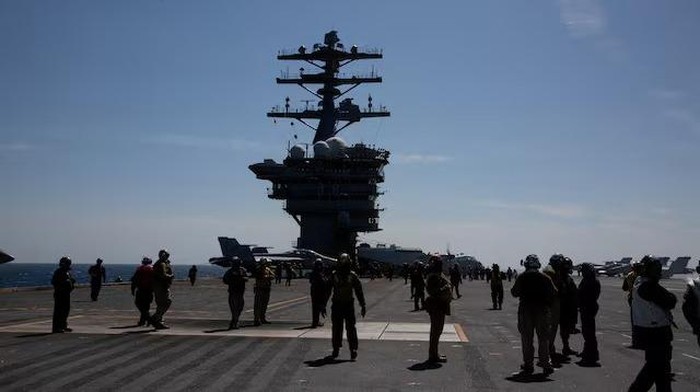 Crews are seen on the flight deck of the USS Nimitz, off the coast of Busan, South Korea, 27 March 2023/Pool via REUTERS/File Photo Purchase Licensing Rights