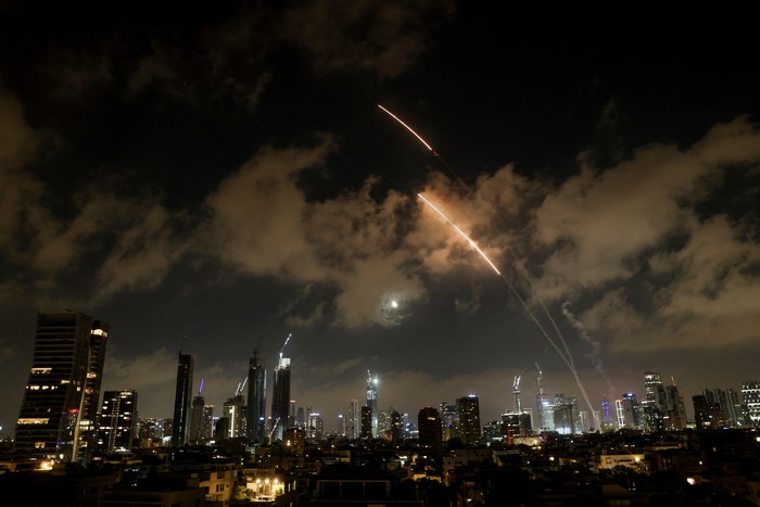 An anti-missile system operates as missiles are launched from Iran, as seen from Tel Aviv, Israel, June 18, 2025. REUTERS/Violeta Santos Moura
