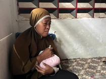 Pilu Ibu Peluk Kantong Berisi Bagian Tubuh Anaknya yang Jadi Korban Kebakaran