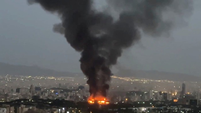 Smoke rises from a fire, as the Israel-Iran air war continues, in Tehran, Iran, in this still image obtained from social media video released June 17, 2025.  Social Media/via REUTERS  THIS IMAGE HAS BEEN SUPPLIED BY A THIRD PARTY. NO RESALES. NO ARCHIVES. NEWS USE ONLY