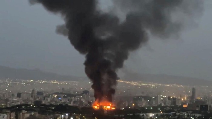 Smoke rises from a fire, as the Israel-Iran air war continues, in Tehran, Iran, in this still image obtained from social media video released June 17, 2025.  Social Media/via REUTERS  THIS IMAGE HAS BEEN SUPPLIED BY A THIRD PARTY. NO RESALES. NO ARCHIVES. NEWS USE ONLY
