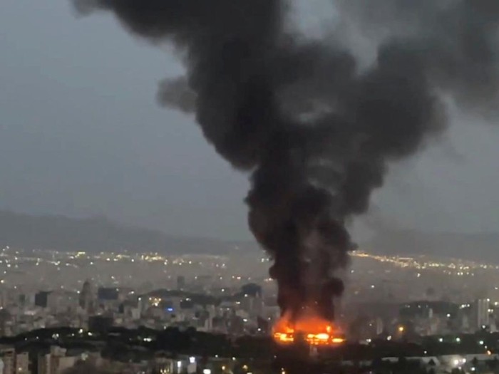 Smoke rises from a fire, as the Israel-Iran air war continues, in Tehran, Iran, in this still image obtained from social media video released June 17, 2025.  Social Media/via REUTERS  THIS IMAGE HAS BEEN SUPPLIED BY A THIRD PARTY. NO RESALES. NO ARCHIVES. NEWS USE ONLY