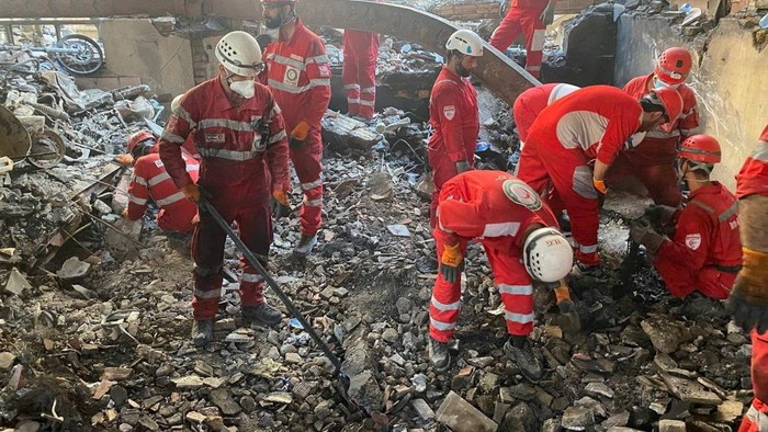 Iranian Red Crescent Society members search through the rubble for victims after Israeli strikes, at an unspecified location in Iran, in this undated image released June 17, 2025 and obtained from social media. Iranian Red Crescent Society via REUTERS ATTENTION EDITORS - THIS IMAGE HAS BEEN SUPPLIED BY A THIRD PARTY. MANDATORY CREDIT. NO RESALES. NO ARCHIVES. TPX IMAGES OF THE DAY