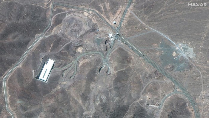 A satellite image shows trucks positioned near the entrance of the Fordow fuel enrichment facility, near Qom, Iran June 19, 2025. Maxar Technologies/Handout via REUTERS    THIS IMAGE HAS BEEN SUPPLIED BY A THIRD PARTY. NO RESALES. NO ARCHIVES. MANDATORY CREDIT. MUST NOT OBSCURE LOGO