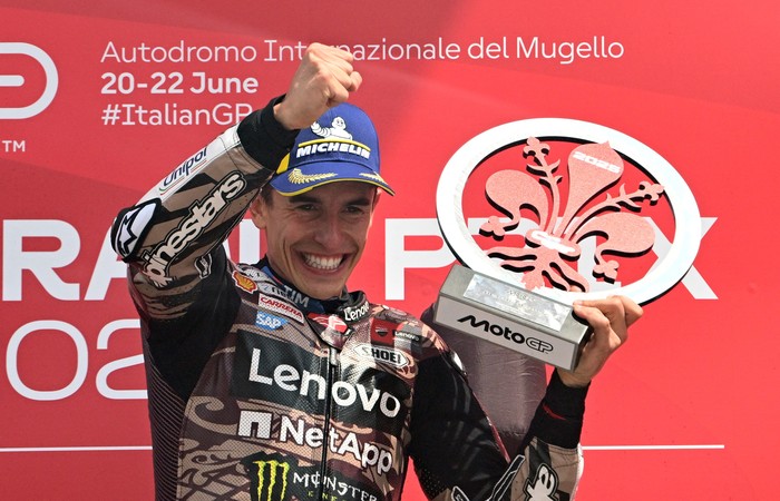 MotoGP - Italian Grand Prix - Mugello Circuit, Scarperia e San Piero, Italy - June 22, 2025 Ducati Lenovo Teams Marc Marquez celebrates on the podium with a trophy after winning the Italian Grand Prix REUTERS/Jennifer Lorenzini
