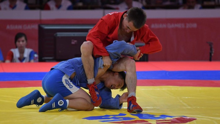 Kazakhstans Ibragim Baglan (R) against Mongolias Shaaluu Erdenebaatar on Sambo mens -52kg gold medal competition at JCC Senayan in Jakarta, Indonesia on August 31, 2018. Kazakhstans Ibragim Baglan wins a gold medal with score 4-0. (Photo by Anton Raharjo/NurPhoto via Getty Images)