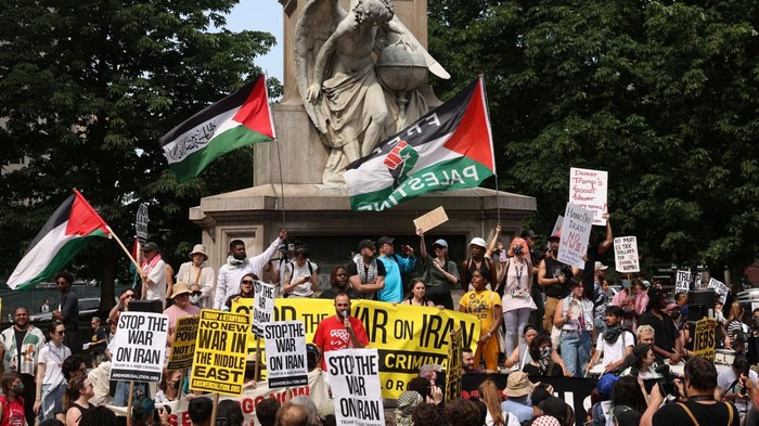 Demonstrators protest following U.S attack on Iran's nuclear sites and against Iran-Israel conflict, at Times Square in New York City, U.S. June 22, 2025. REUTERS/Caitlin Ochs