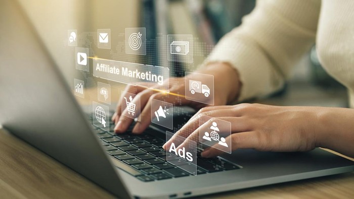 Affiliate marketing, online business model concept. Women use laptop with virtual screen of affiliate marketing icons and SEO functions. make money online for social media marketing. business strategy