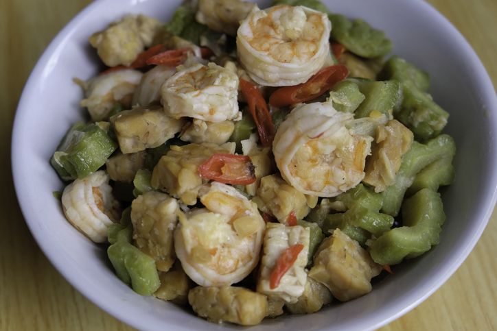 Close up of stir fried shrimps with tempeh and bitter gourd.