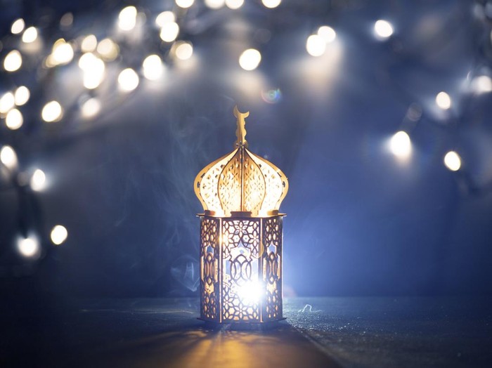 Close-Up Of Illuminated Lamp Against Lighting Equipment