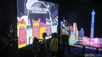 Studio Imersif di TIM menghadirkan pengalaman literasi modern yang menggabungkan teknologi digital, kecerdasan buatan (AI), dan arsip digital dalam satu ruang interaktif. Konsep ini membuat proses belajar menjadi lebih menarik dan menyenangkan, terutama bagi generasi muda.  