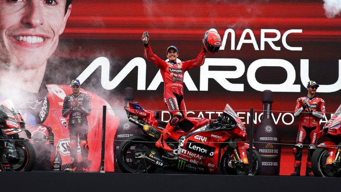 MotoGP - Grand Prix of Netherlands -TT Circuit Assen, Assen, Netherlands - June 29, 2025 Ducati Lenovo Teams Marc Marquez celebrates on the podium after winning the Grand Prix of Netherlands alongside second placed Aprilia Racings Marco Bezzecchi and third placed Ducati Lenovo Teams Francesco Bagnaia REUTERS/Yves Herman