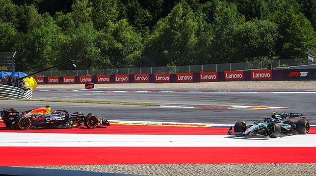 SPIELBERG, AUSTRIA - JUNE 29: Max Verstappen of the Netherlands driving the (1) Red Bull Racing RB21 on track with Andrea Kimi Antonelli of Italy driving the (12) Mercedes W16 on track. following contact during the F1 Grand Prix of Austria at Red Bull Ring on June 29, 2025 in Spielberg, Austria. (Photo by Jayce Illman/Getty Images)