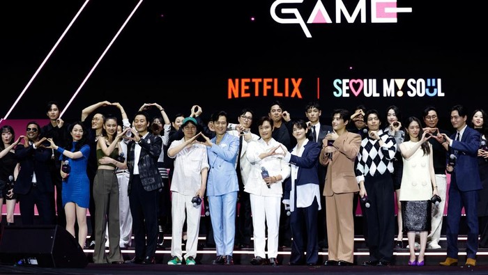 Performers dressed as 'Squid Game' soldiers stand with Squid Game-themed coffins, before a parade through central Seoul, followed by a fan event with cast to celebrate the release of the third season of Netflix's hit series, in Seoul, South Korea, June 28, 2025. REUTERS/Kim Soo-hyeon