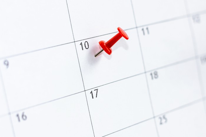 calendar entry. 10 day marked by Red color pin thumbtack. Save the Date concept.