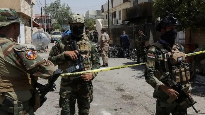 Members of Iraqi security forces stand near the debris of an armed drone shot down by Iraqs air defenses in Kirkuk, Iraq, August 29, 2024. (File photo: Reuters)