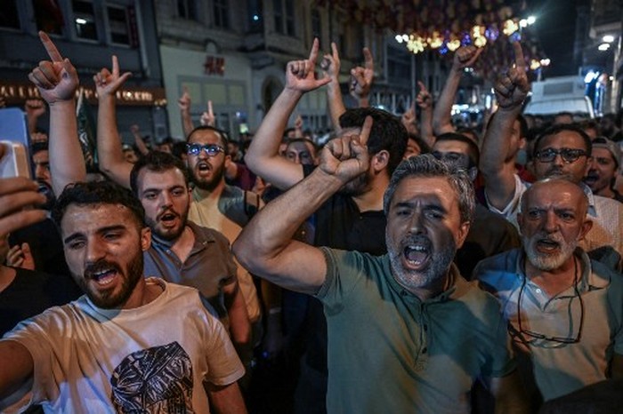 Islamist protesters clash with Turkish anti riot police officers as they gather to protests Leman cartoon magazine in Istanbul on June 30,2025. Clashes erupted in Istanbul Monday with police firing rubber bullets and tear gas to break up an angry mob after allegations that a satirical magazine had published a cartoon of the Prophet Mohammed, an AFP correspondent said. The incident occurred after Istanbul's chief prosecutor ordered the arrest of the editors at LeMan magazine on grounds it had published a cartoon which 