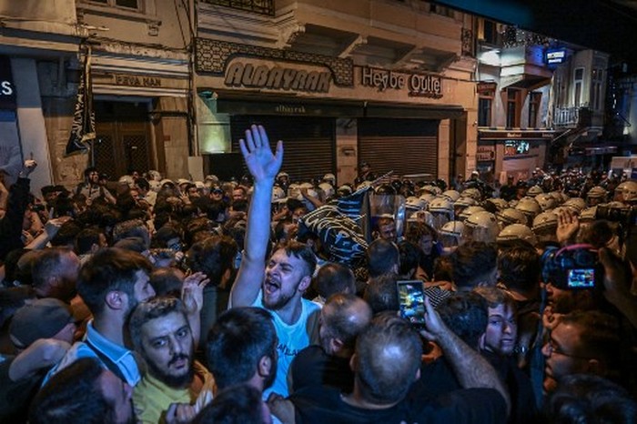 Islamist protesters clash with Turkish anti riot police officers as they gather to protests Leman cartoon magazine in Istanbul on June 30,2025. Clashes erupted in Istanbul Monday with police firing rubber bullets and tear gas to break up an angry mob after allegations that a satirical magazine had published a cartoon of the Prophet Mohammed, an AFP correspondent said. The incident occurred after Istanbul's chief prosecutor ordered the arrest of the editors at LeMan magazine on grounds it had published a cartoon which 